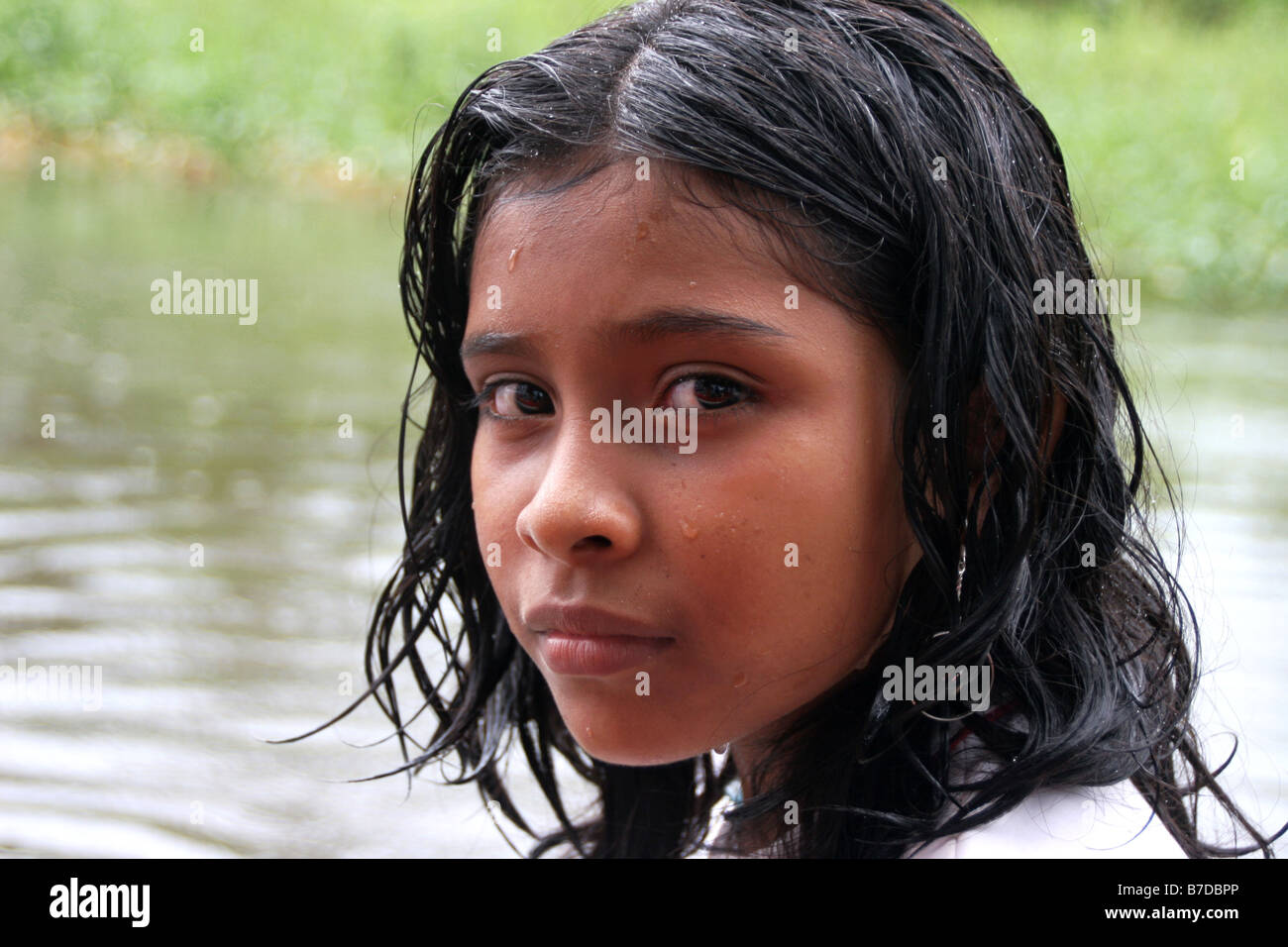 Face of young girl during heavy rains on Rio San Juan River in Nicaragua, Nicaragua, Rio San Juan Stock Photo