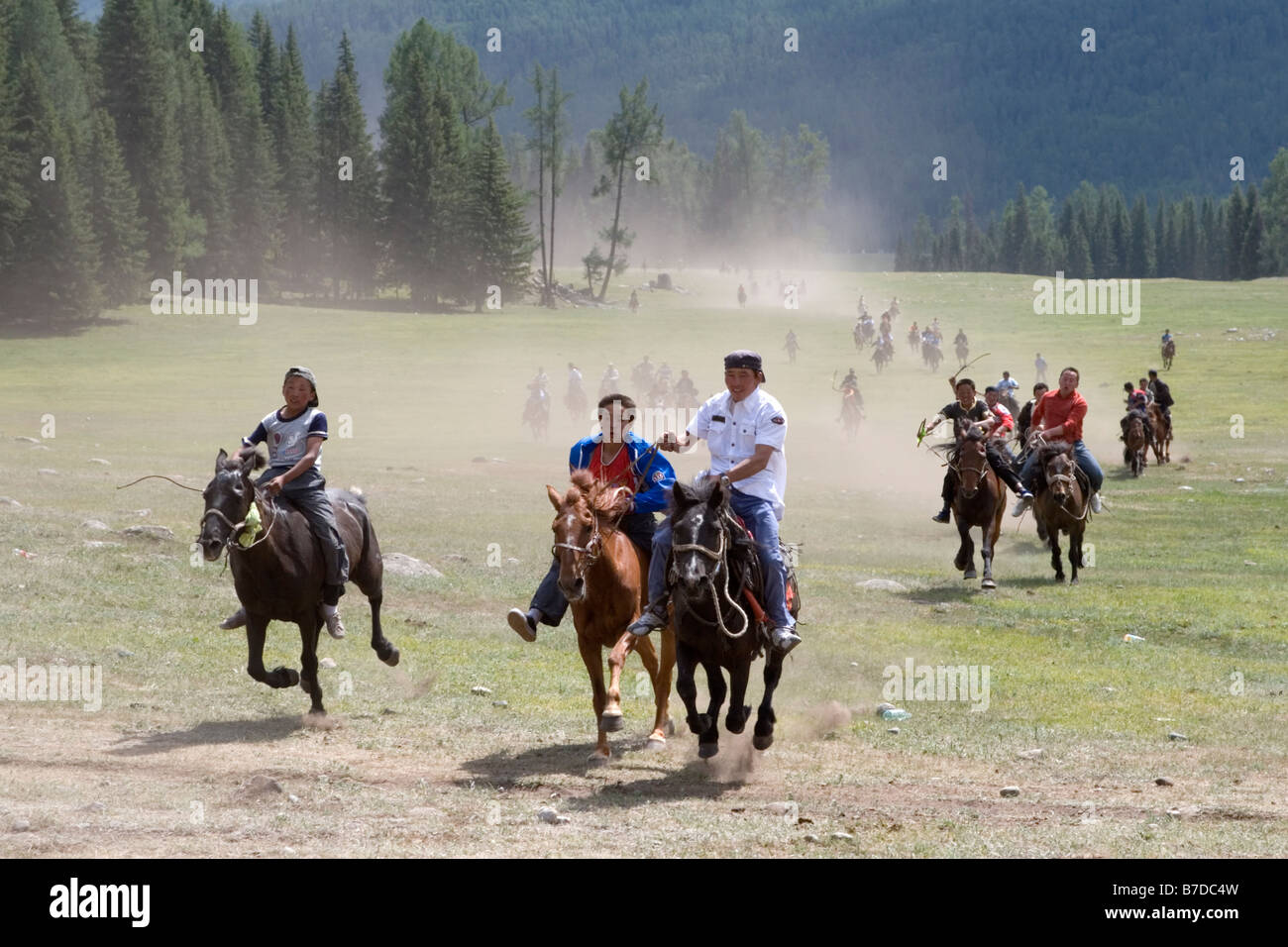 Horse racing during the Mongolian annual competition called Ao Bao Jie. Stock Photo