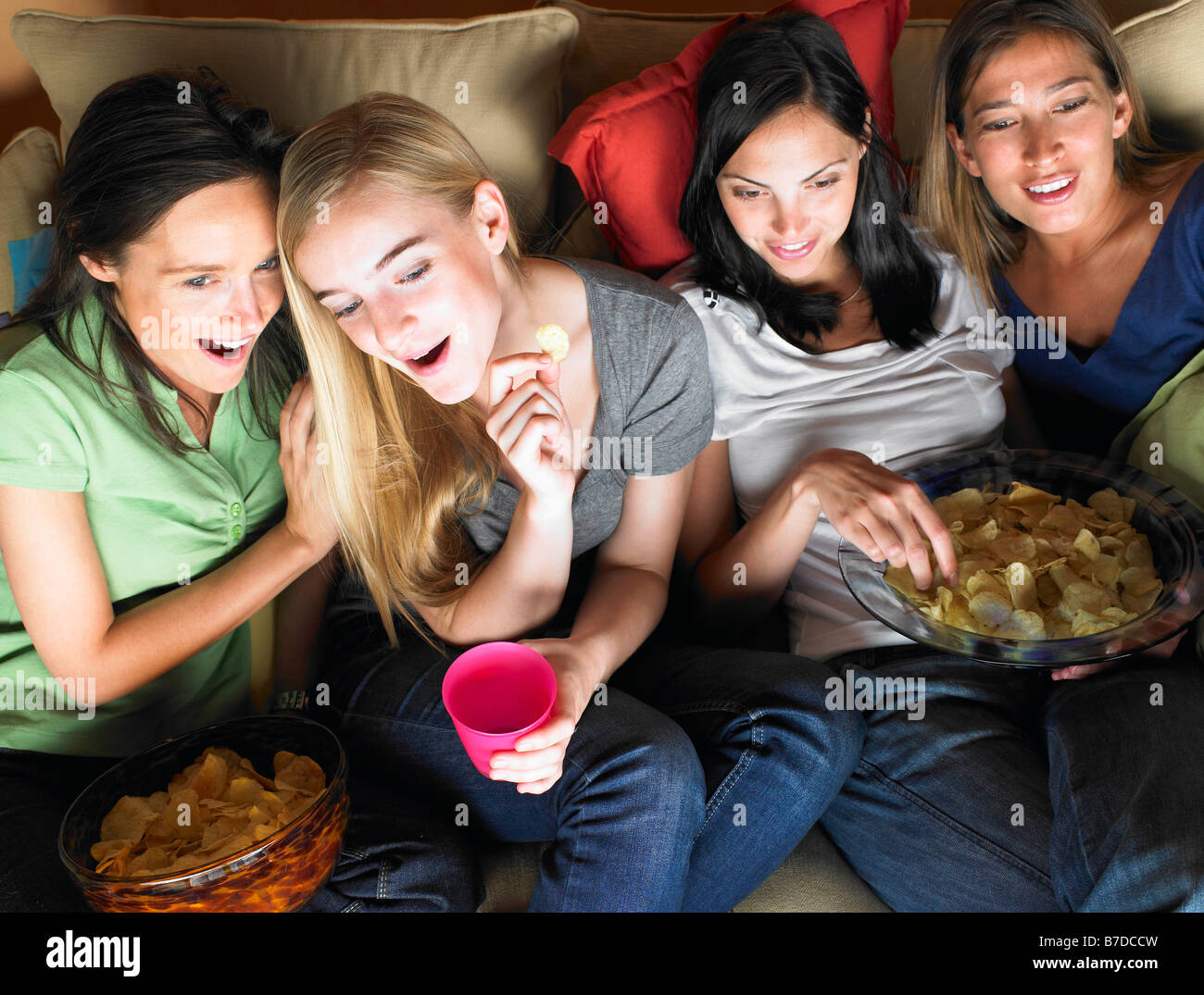 Women watching television Stock Photo