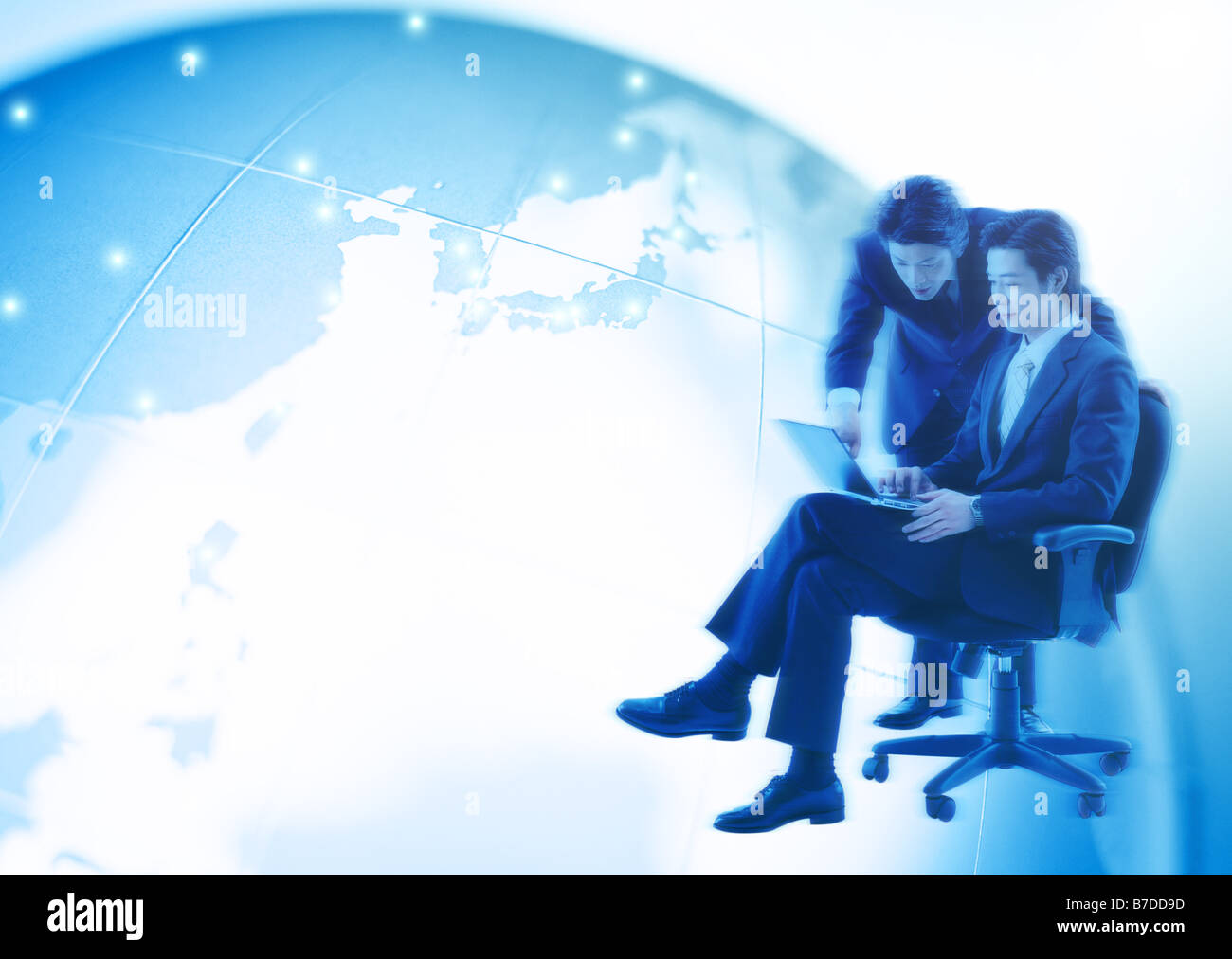Global businessman sitting on chair Stock Photo - Alamy