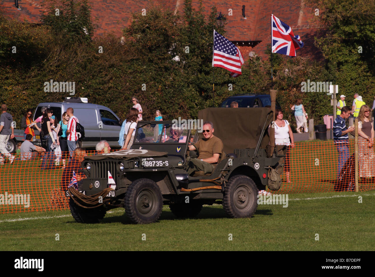 US army jeep camouflaged camouflage open top old biddenden village spectacular day out kent england uk europe Stock Photo