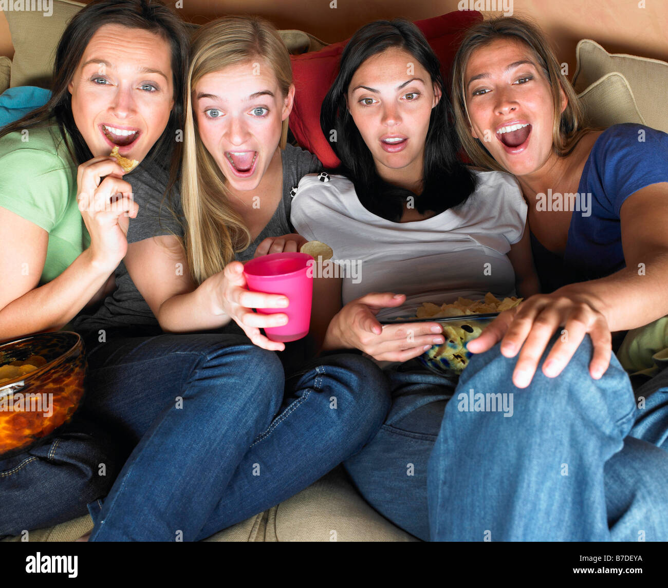 Women watching television Stock Photo