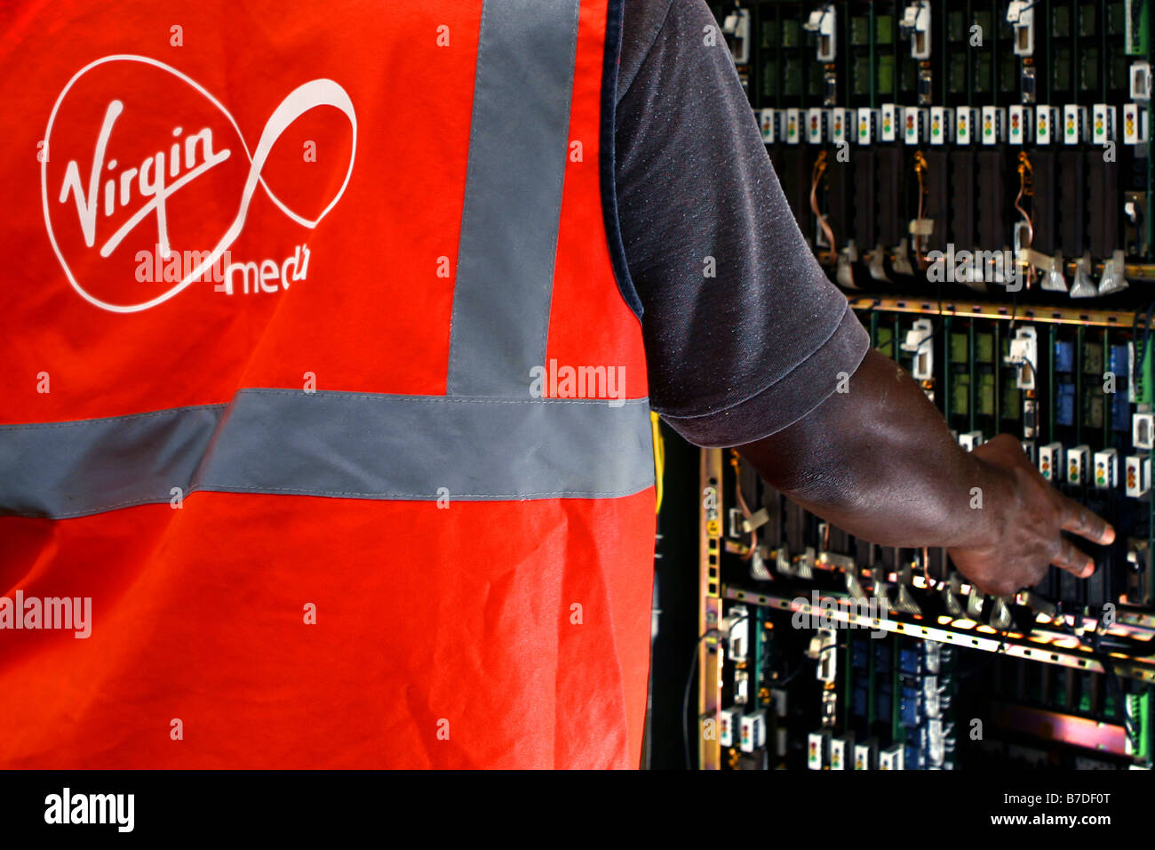 Virgin Mobile engineers connecting a house to the Virgin telephone