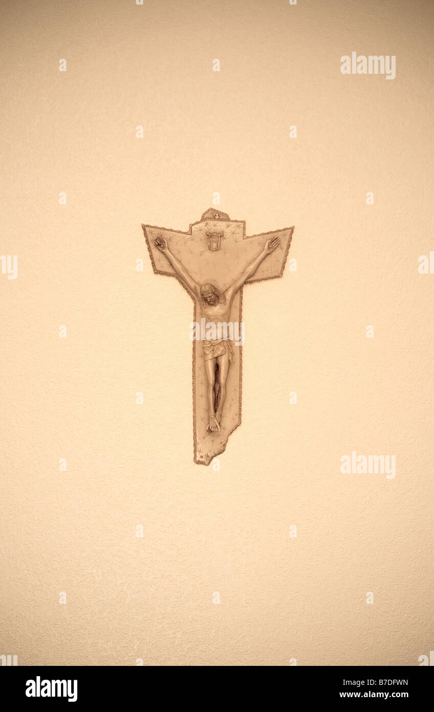 A Crucifix is photographed hanging on a wall in a catholic house in the