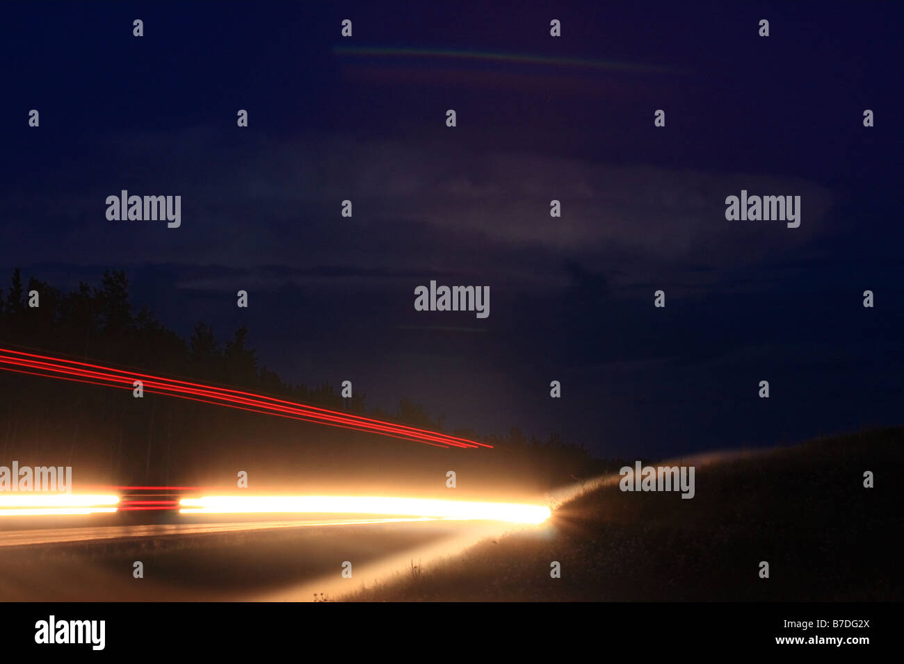 Car lights at night in nothern Alberta Stock Photo