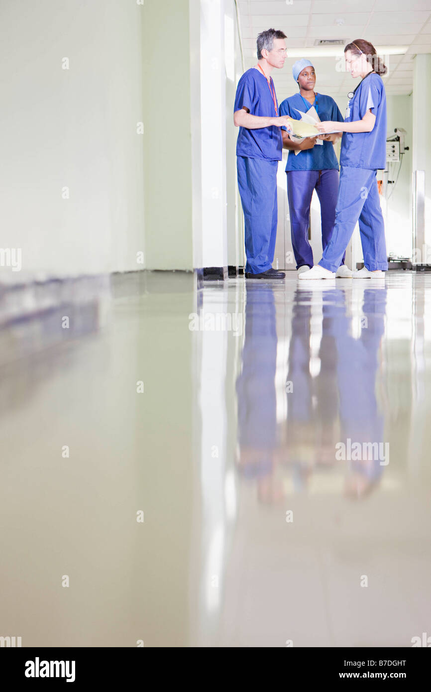 Three medical staff talking Stock Photo Alamy