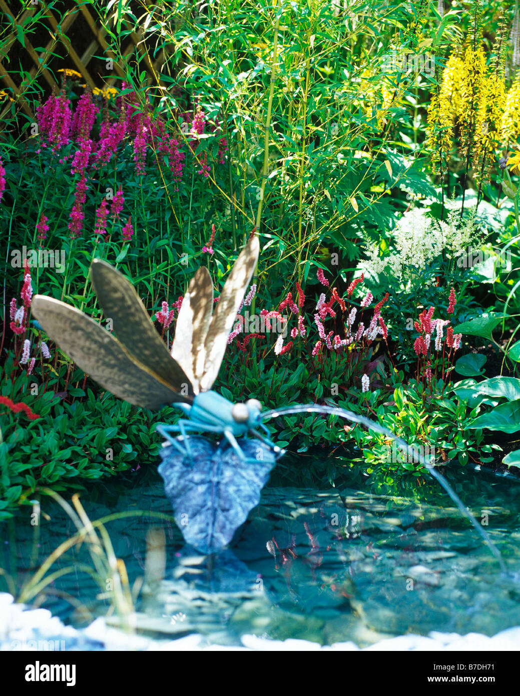 DRAGONFLY FOUNTAIN IN SMALL POND Stock Photo Alamy