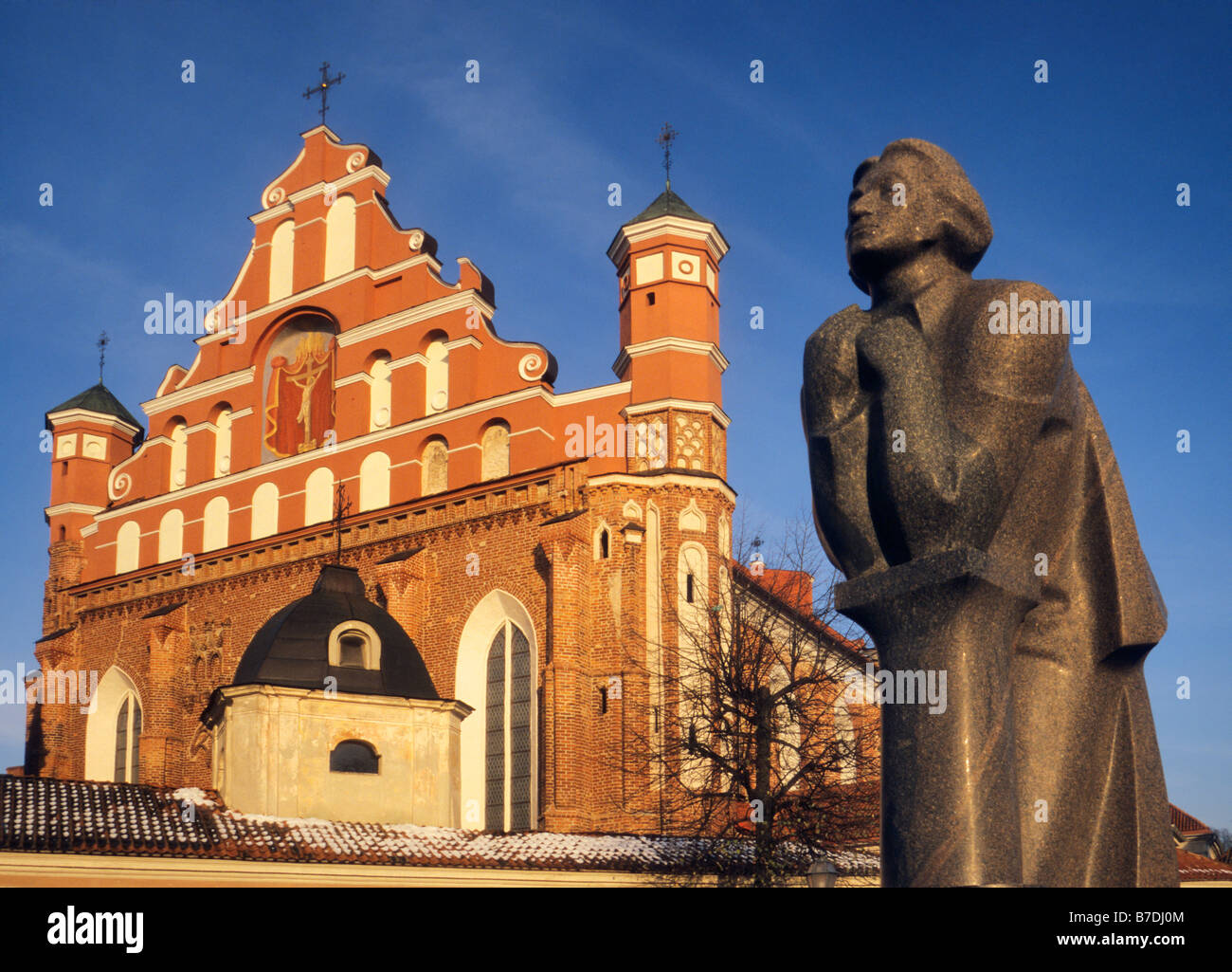 Statue of Polish poet Adam Mickiewicz in front of Bernardine Church in Vilnius Lithuania Stock Photo