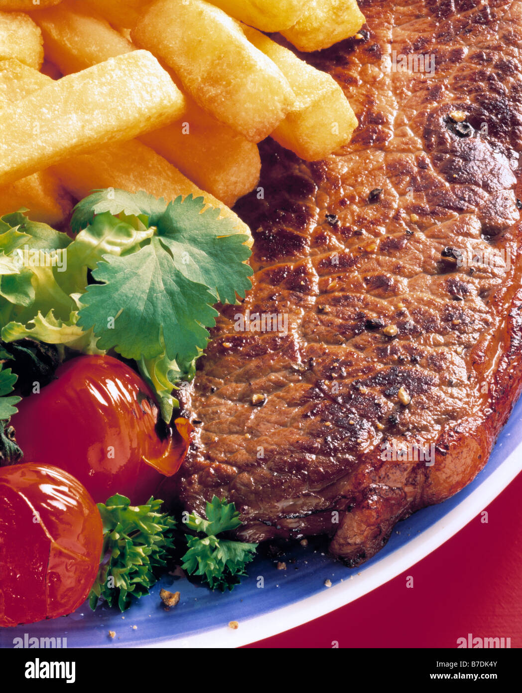 Individual portion grilled sirloin steak french fries hires stock