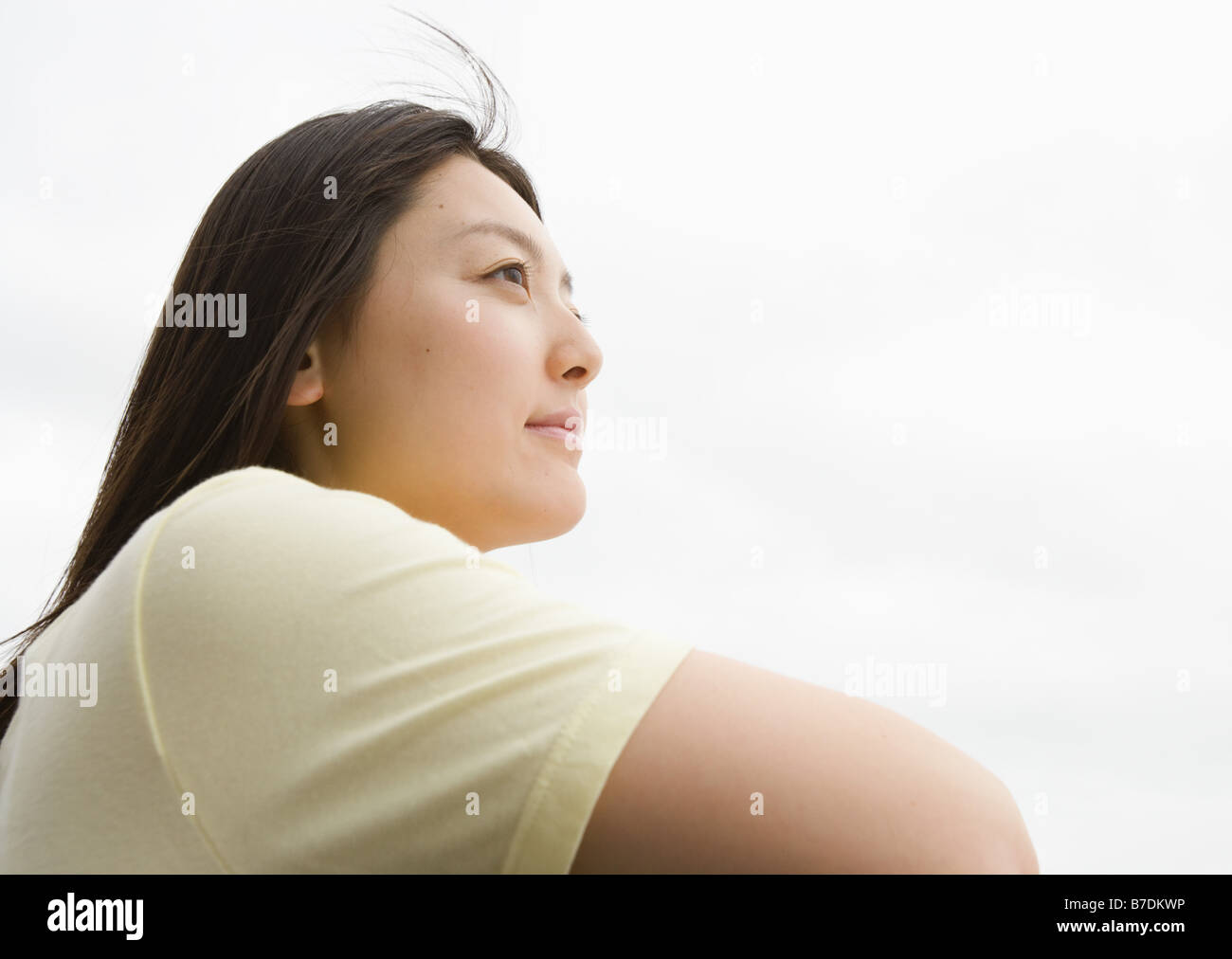 Young woman looking away Stock Photo - Alamy