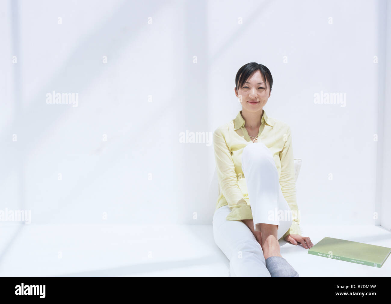 Woman relaxed on floor Stock Photo - Alamy