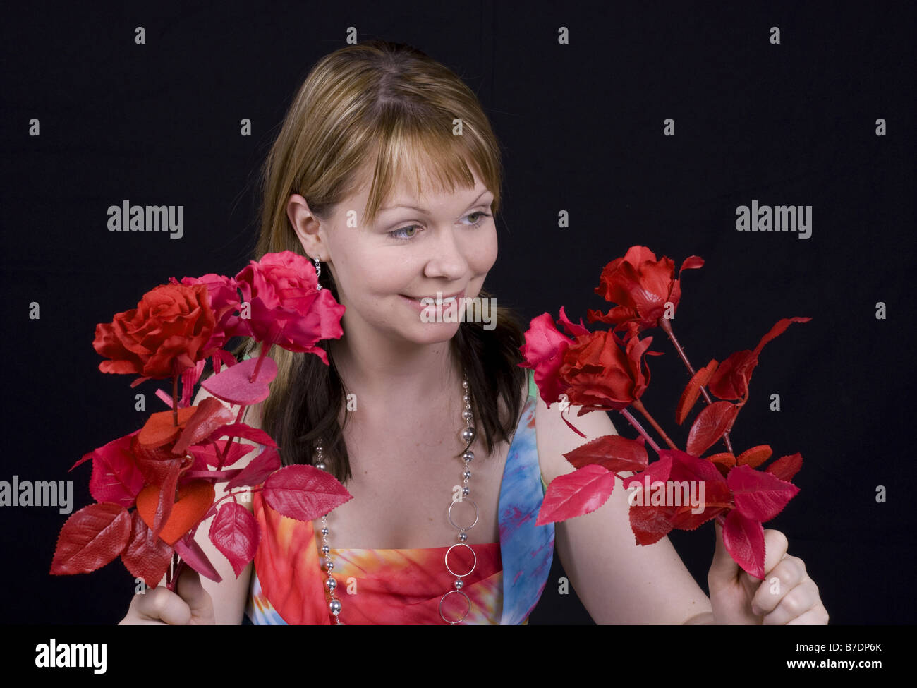 young woman with artificial bunch of roses Stock Photo - Alamy