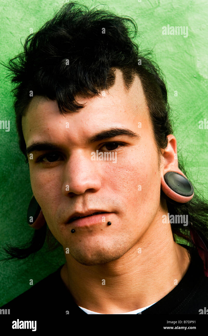 Portrait of a Brazilian man wearing fashionable Yamamano style earings. Stock Photo