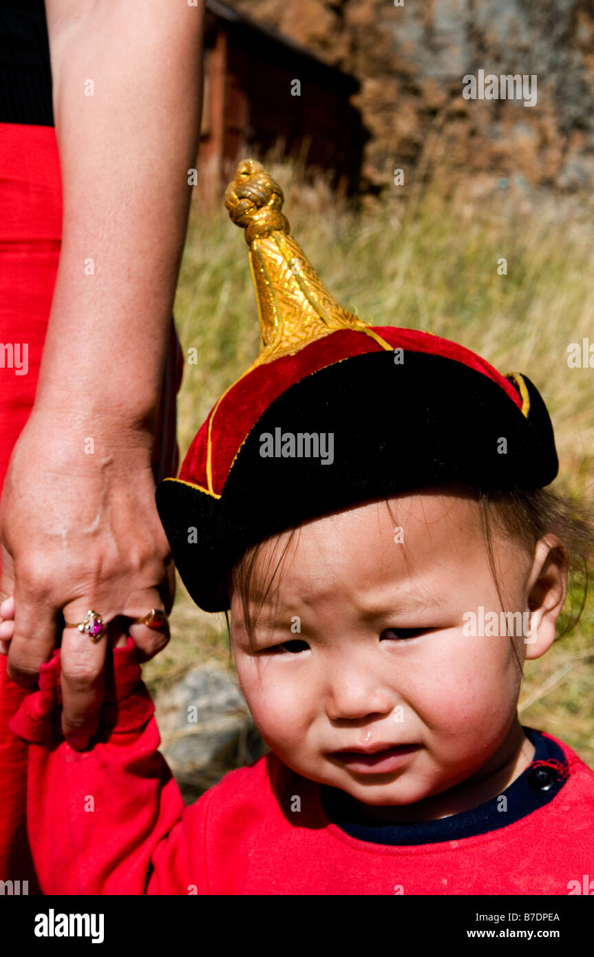 A cute Mongolian boy wearing a traditional Mongolian hat Stock Photo ...