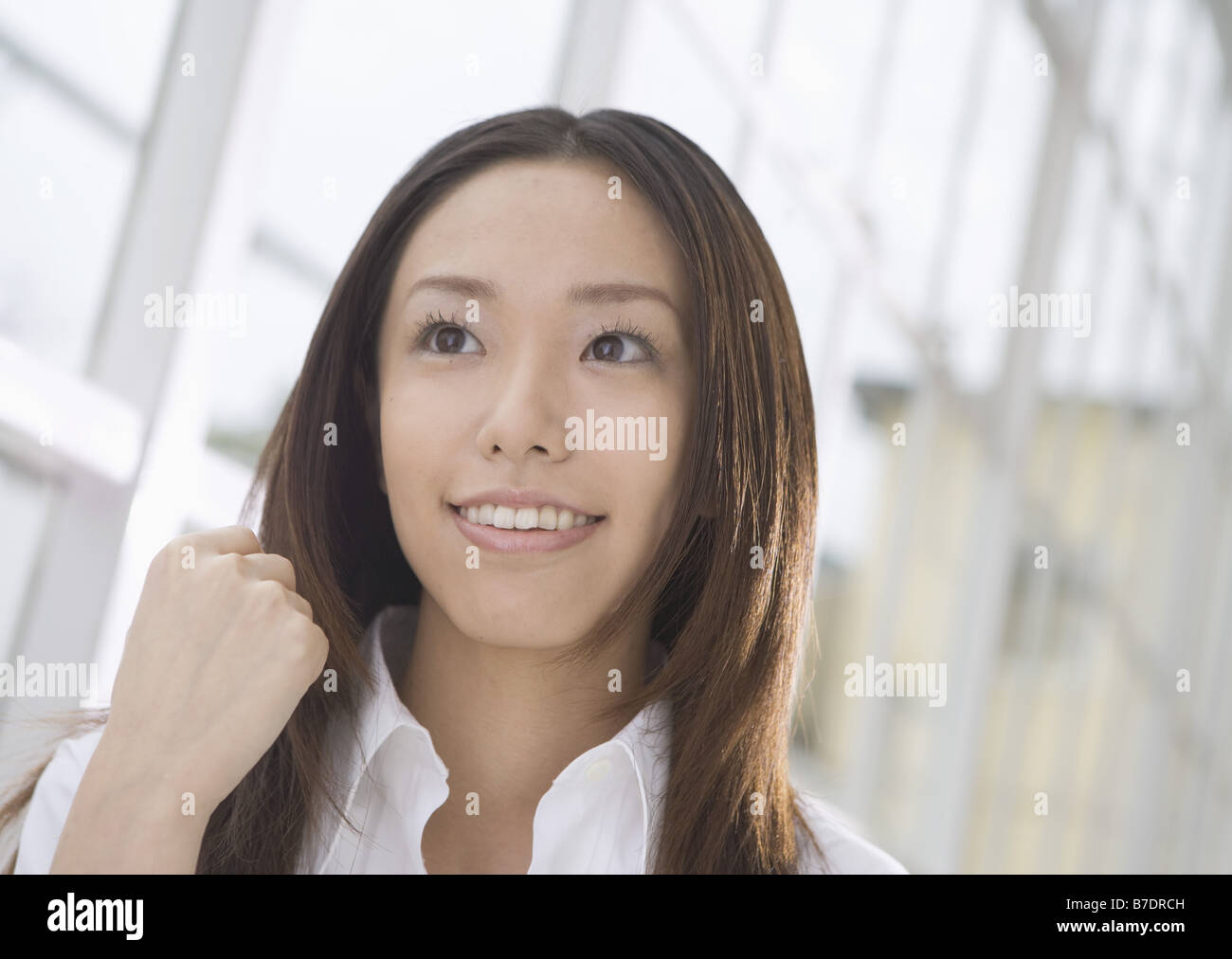 Woman with long hair in white shirt Stock Photo - Alamy