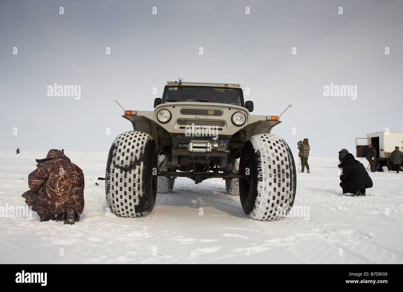 Ice fishing for smelts by modified Jeep,  Anadyr Chukotka, Siberia Russia Stock Photo