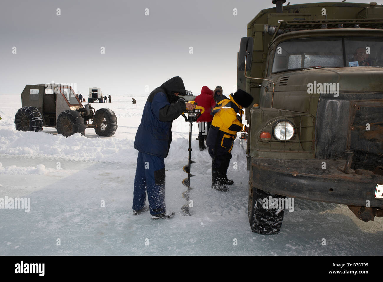 Drilling hole for Ice fishing, Anadyr Chukotka, Siberia Russia Stock Photo