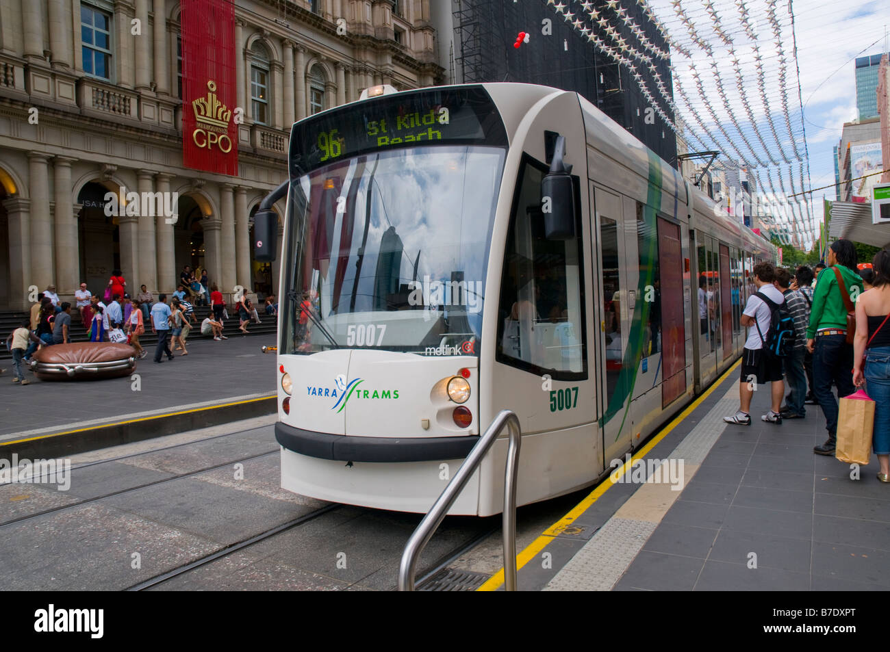 A Melbourne tram picking up passengers in the central city Stock Photo