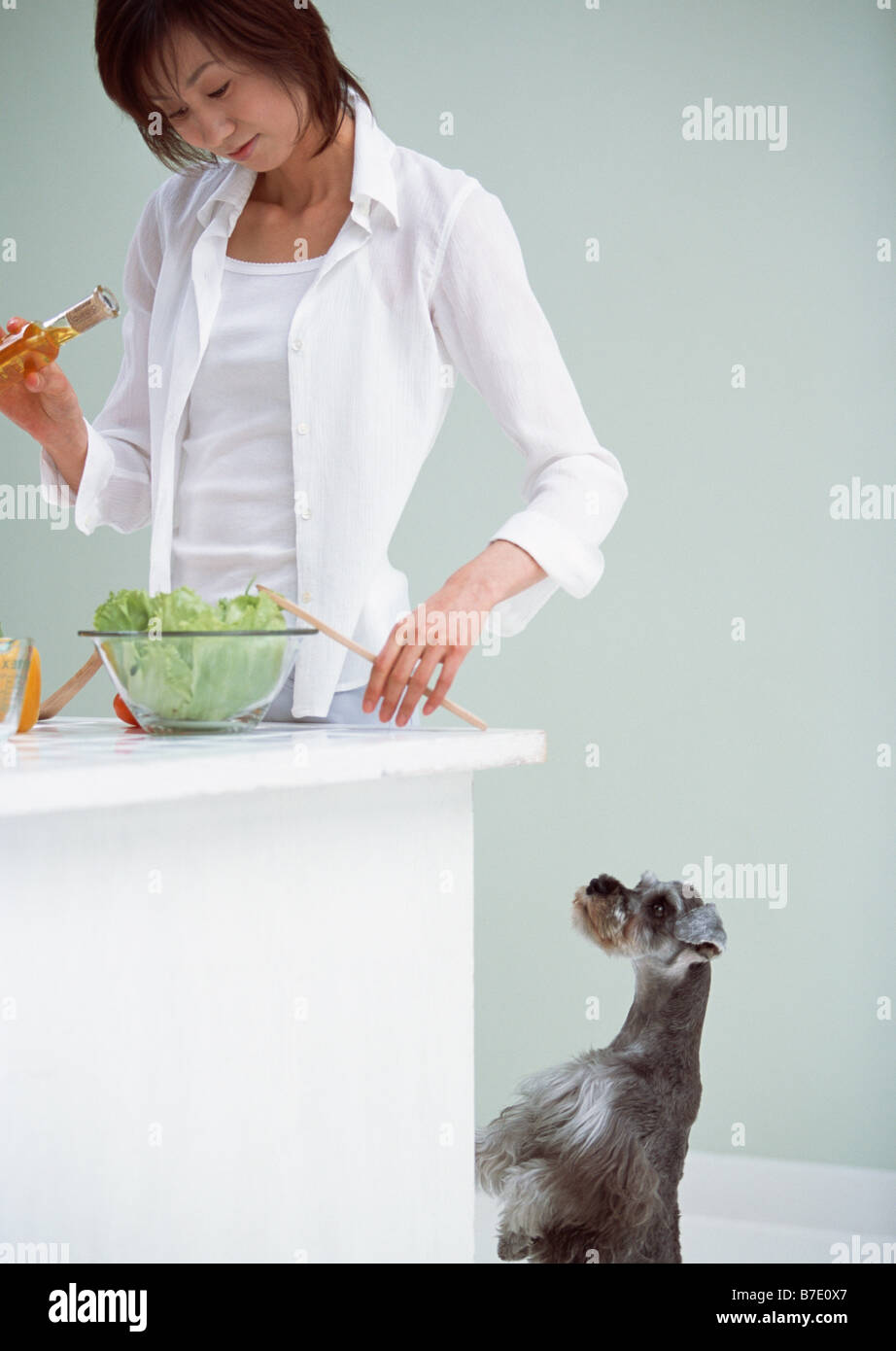 Cooking in kitchen with dog Stock Photo - Alamy