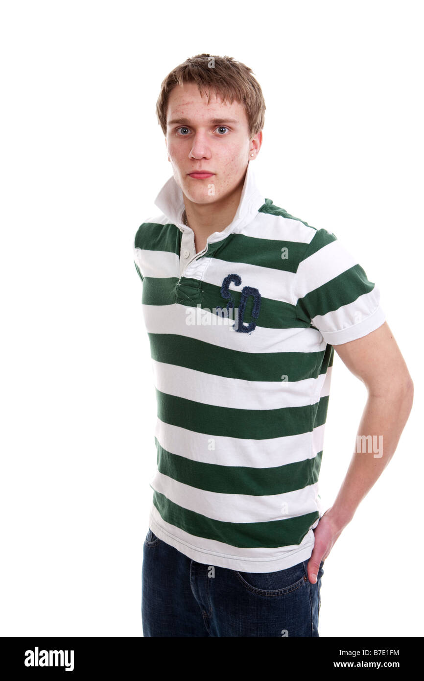 Teenage Lad Hands In Pockets Staring At Viewer And With No Nonsense Look Stock Photo