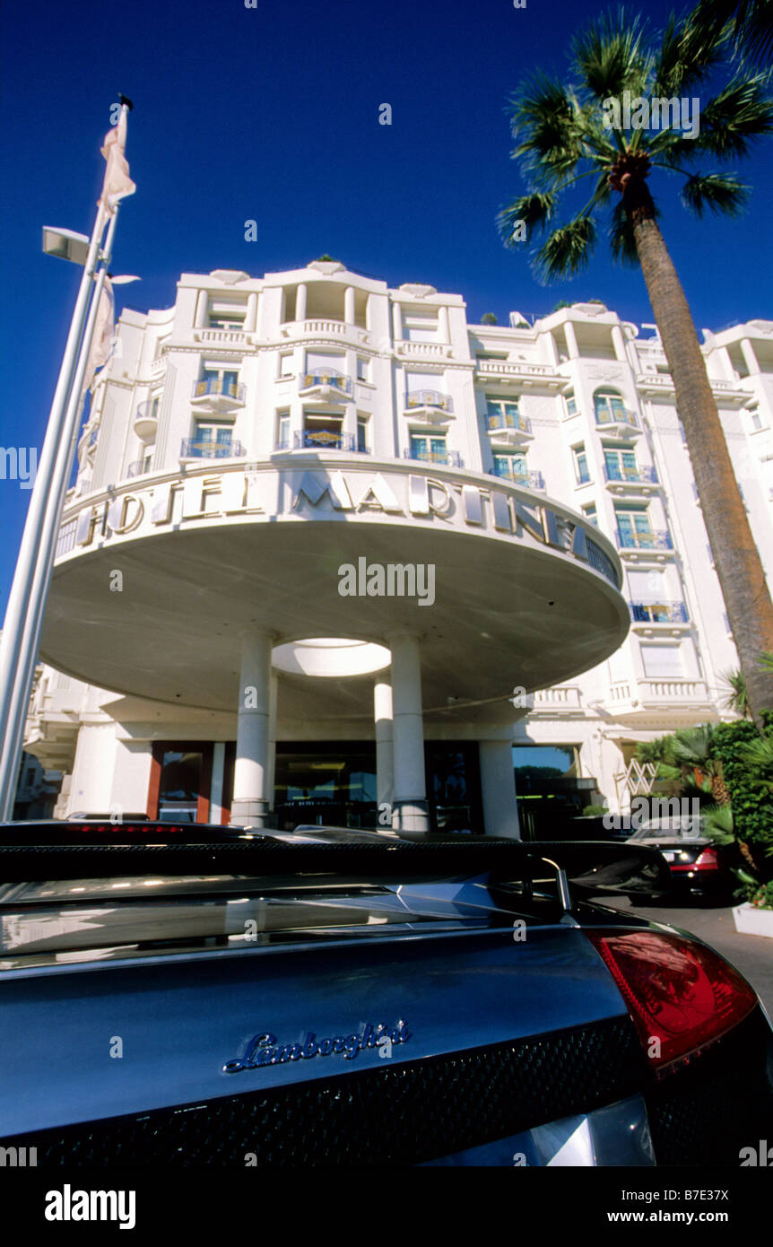 Luxury car parked in front of the prestigious Martinez hotel in the Croisette of Cannes Stock Photo