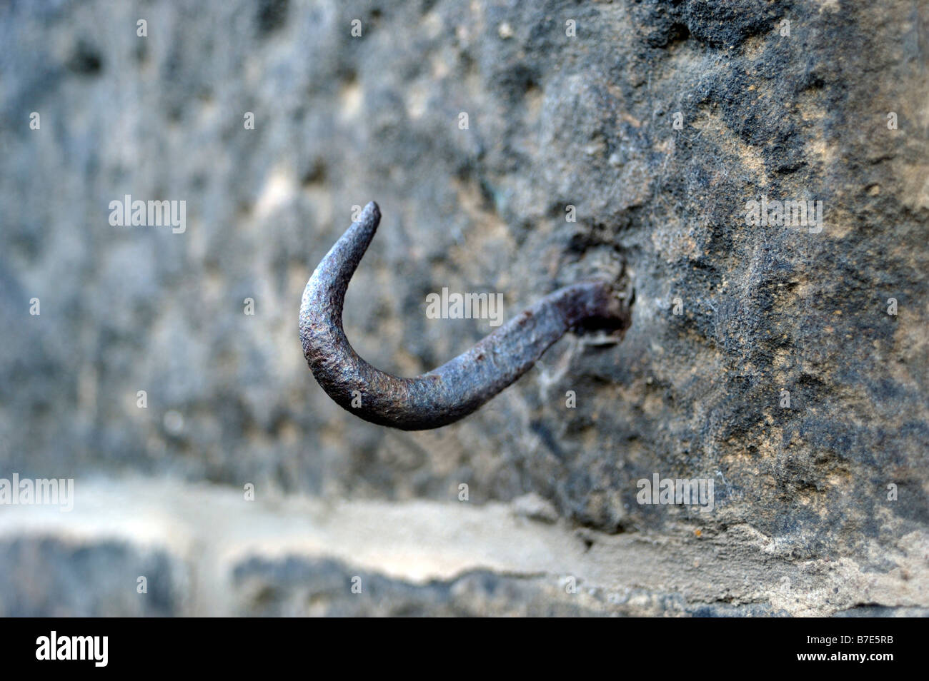 Metal hook in a stone wall Stock Photo Alamy