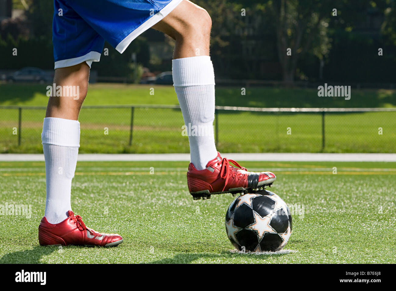 Legs of a footballer and football Stock Photo Alamy