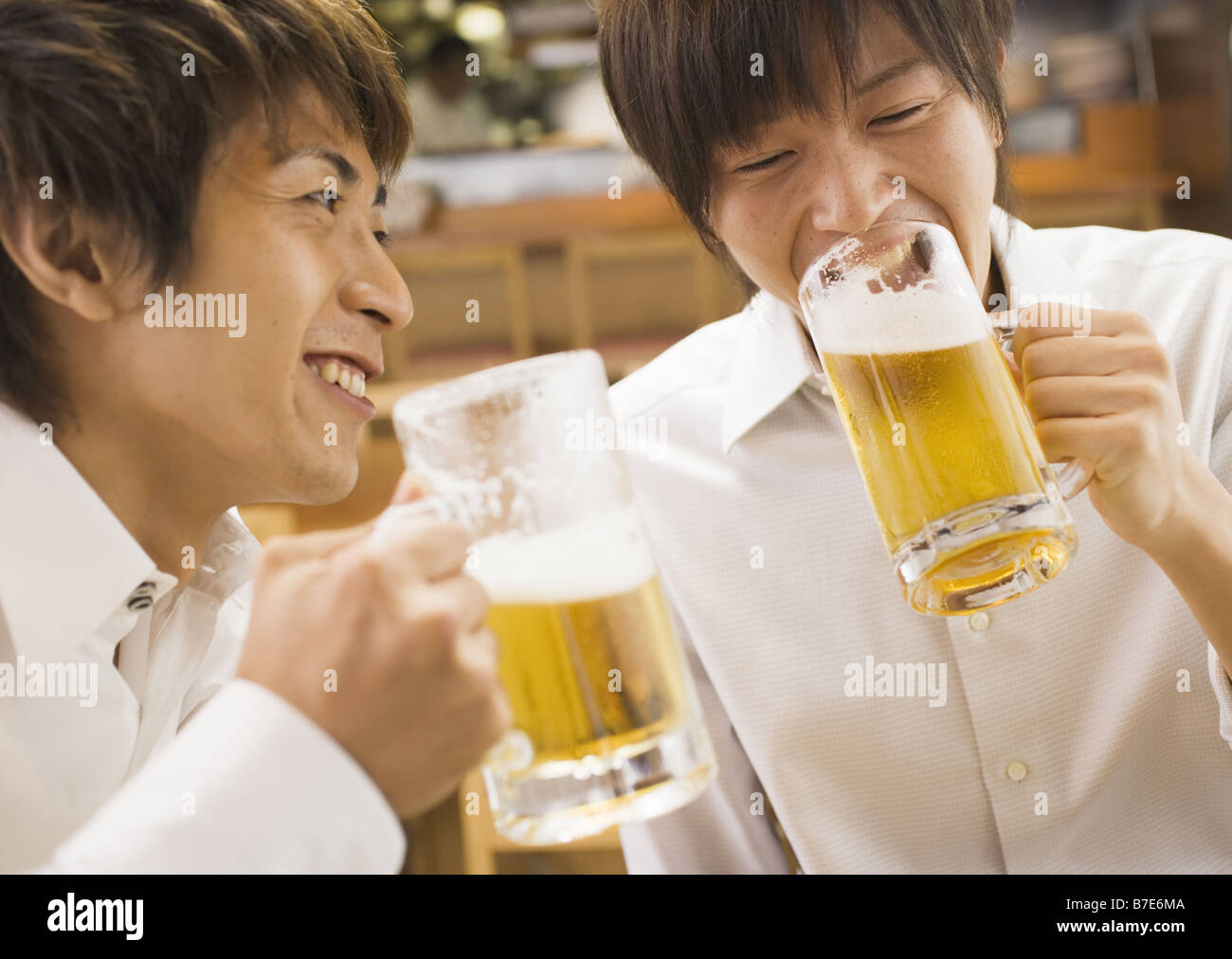 Men Having a Beer in Pub Stock Photo