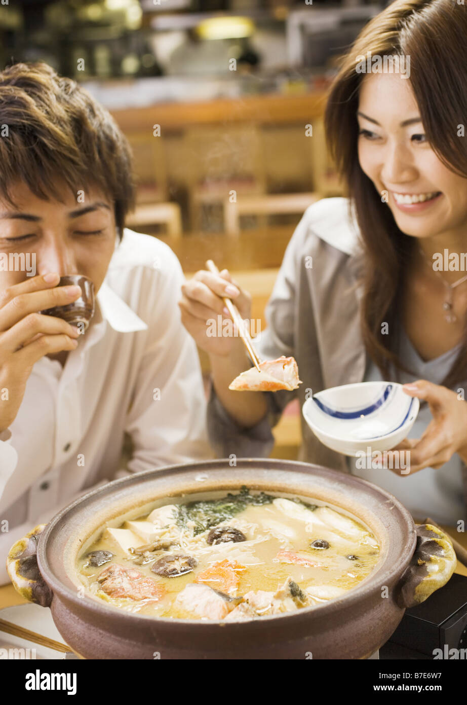 Couple Eating Japanese Style Chowder Stock Photo Alamy