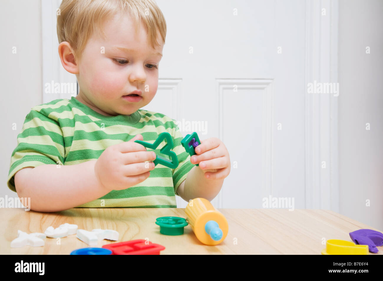 Little boy with toys Stock Photo