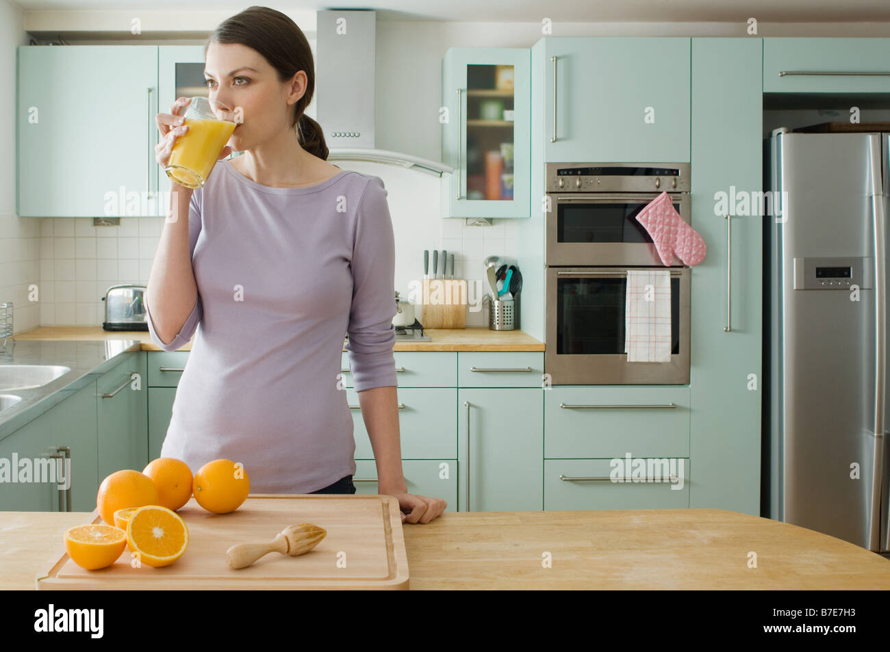 Woman with orange juice Stock Photo