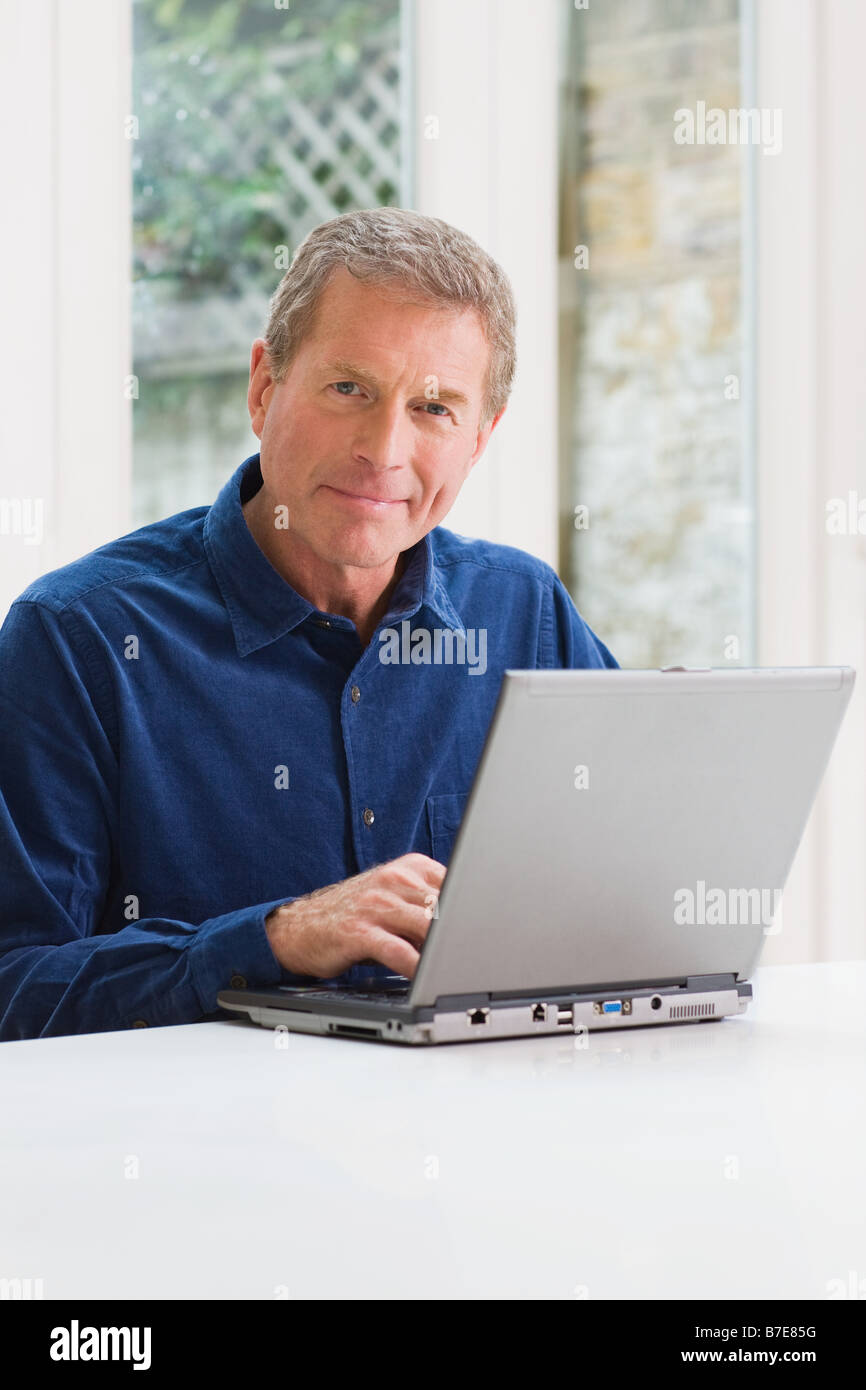 Man home laptop eye contact hi-res stock photography and images - Alamy