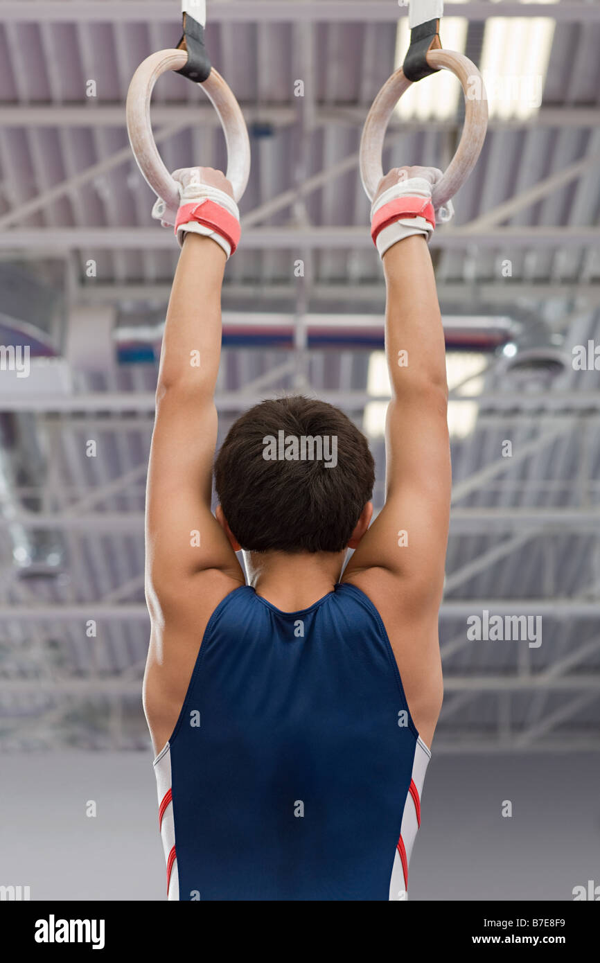 Gymnast hanging from a gymnastic ring Stock Photo Alamy
