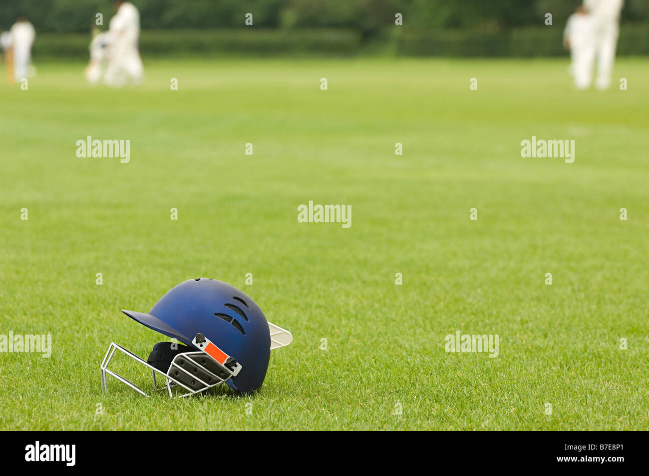 Cricket helmet on a cricket ground Stock Photo Alamy
