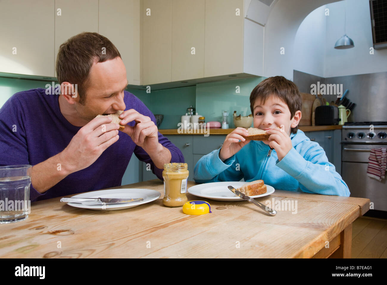 Child eating peanut butter sandwich hires stock photography and images