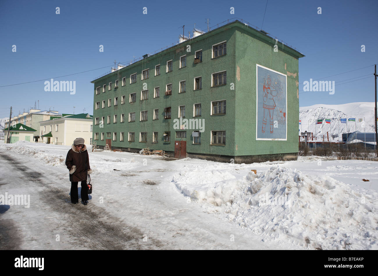 Woman walking in Egvekinot,  Chukotka Siberia Russia Stock Photo