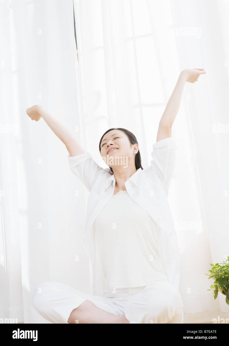 Woman stretching her arms Stock Photo - Alamy