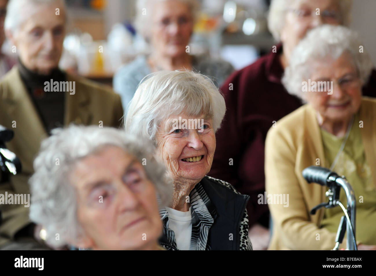 Elderly people participate in a discussion during a health promotion day run by the Bradford Council Ilkley West Yorkshire Stock Photo