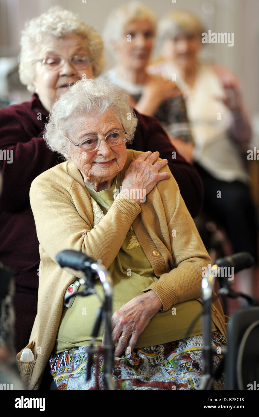 Elderly People Participate In Chair Exercises During A Health