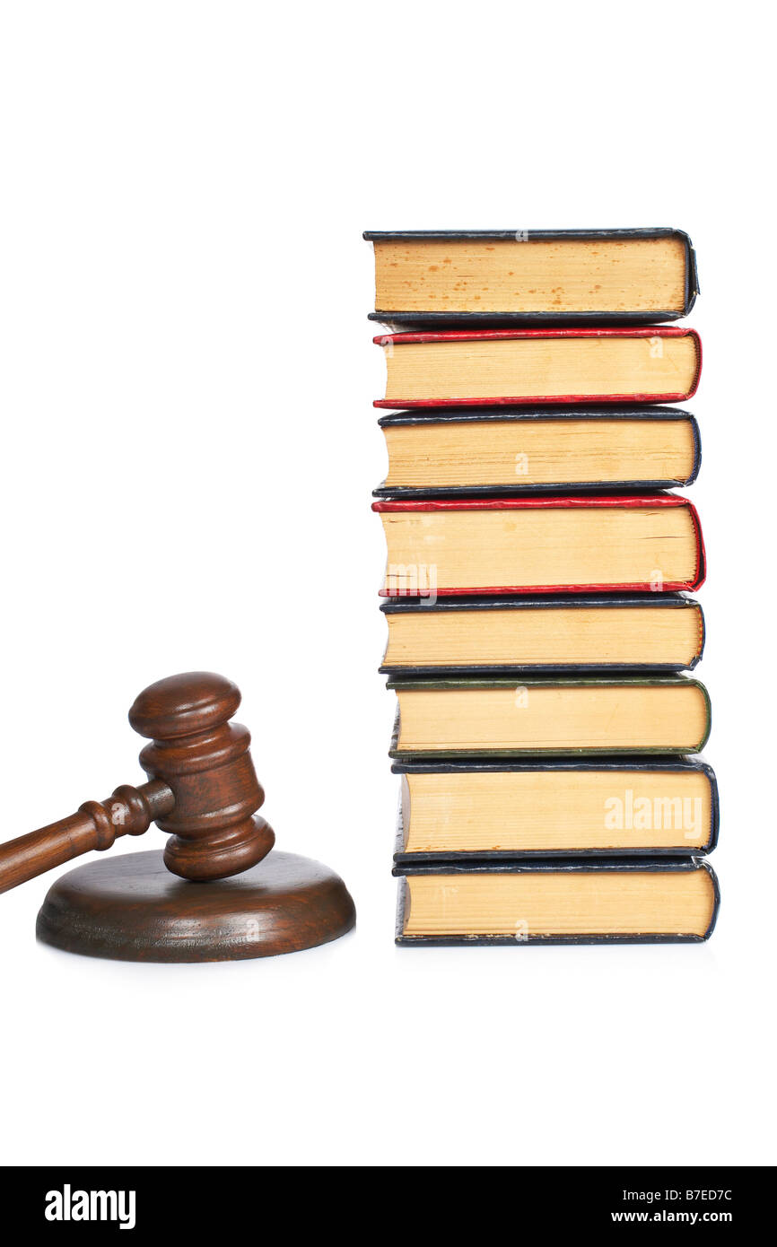 Wooden gavel from the court and old law books isolated on white