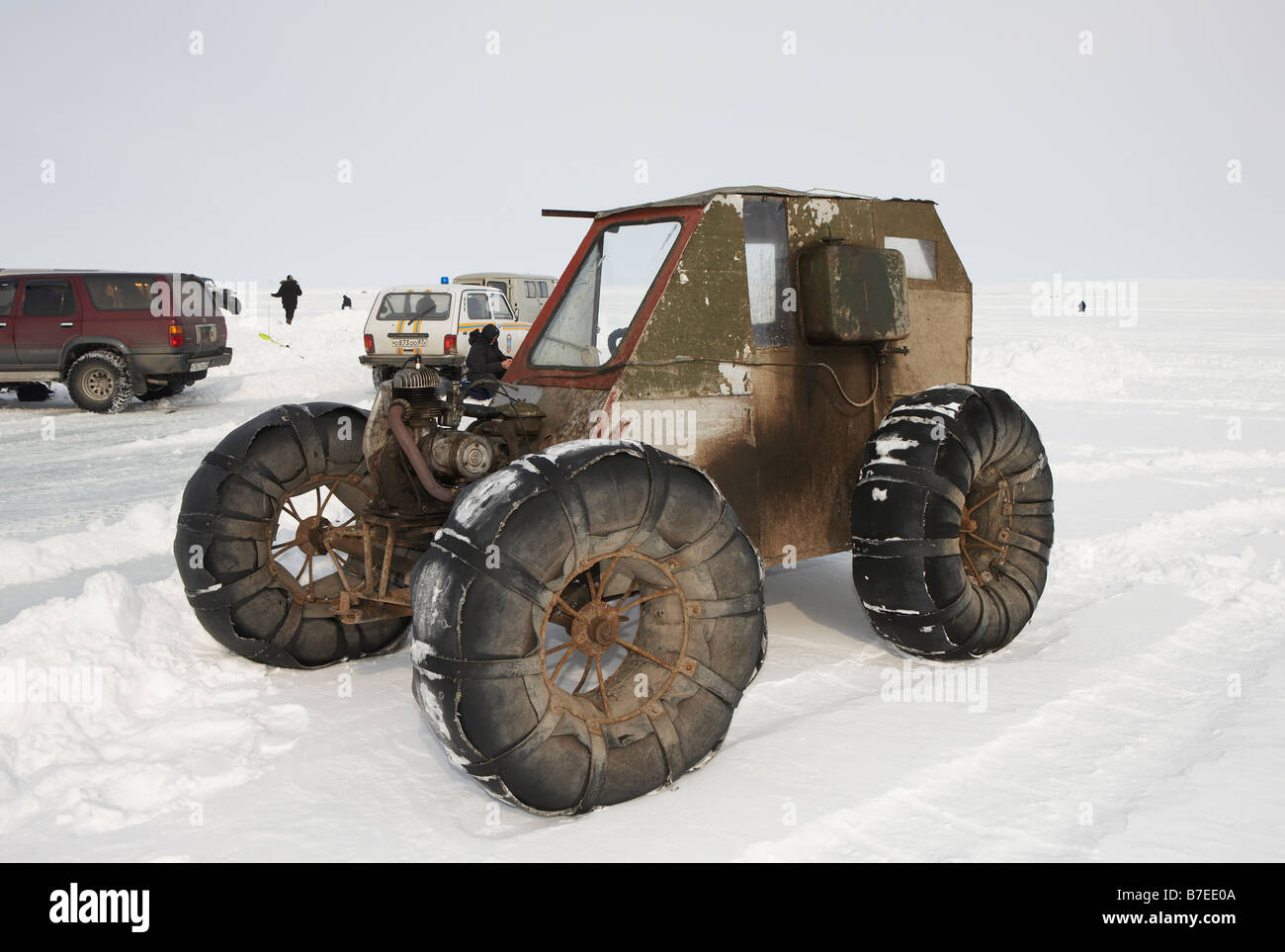 Ice fishing for smelts by homemade 4 wheeler vehicle,  Anadyr Chukotka, Siberia Russia Stock Photo