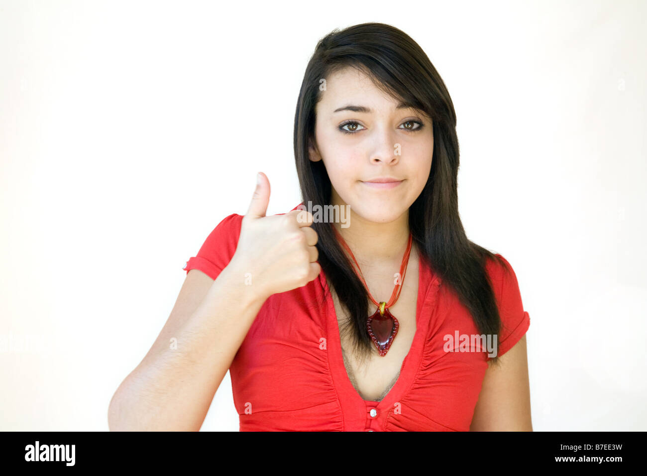 teenage girl giving the thumbs up sign Stock Photo