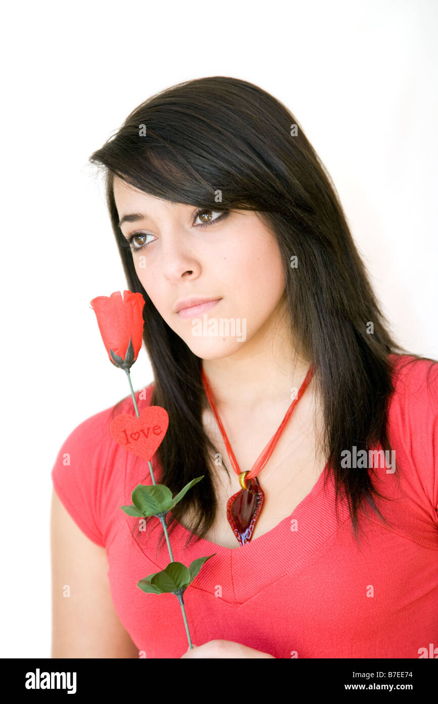 Teenage girl with red rose Stock Photo - Alamy