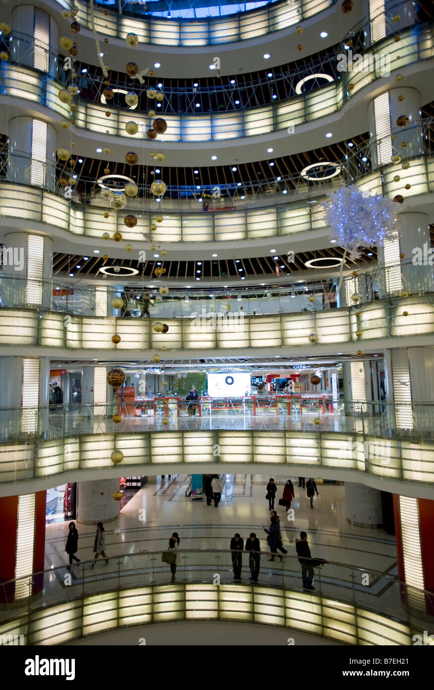 Interior of large new modern shopping mall called Joy City in Xidan district Beijing 2009 Stock Photo