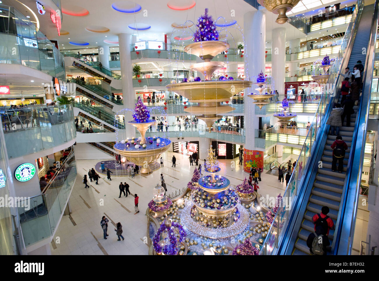 Interior of large new modern shopping mall called Joy City in Xidan district Beijing Stock Photo