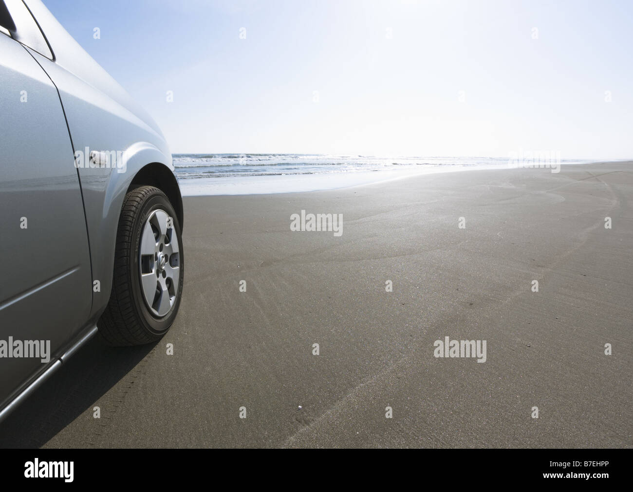 Car on a sandy beach Stock Photo