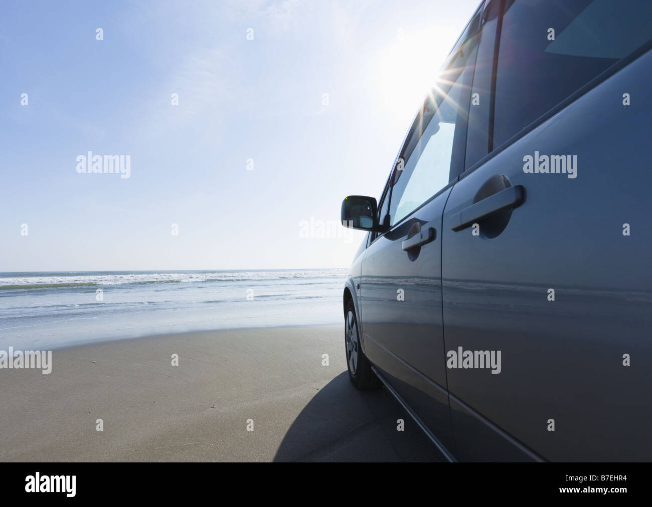 Car on a sandy beach Stock Photo