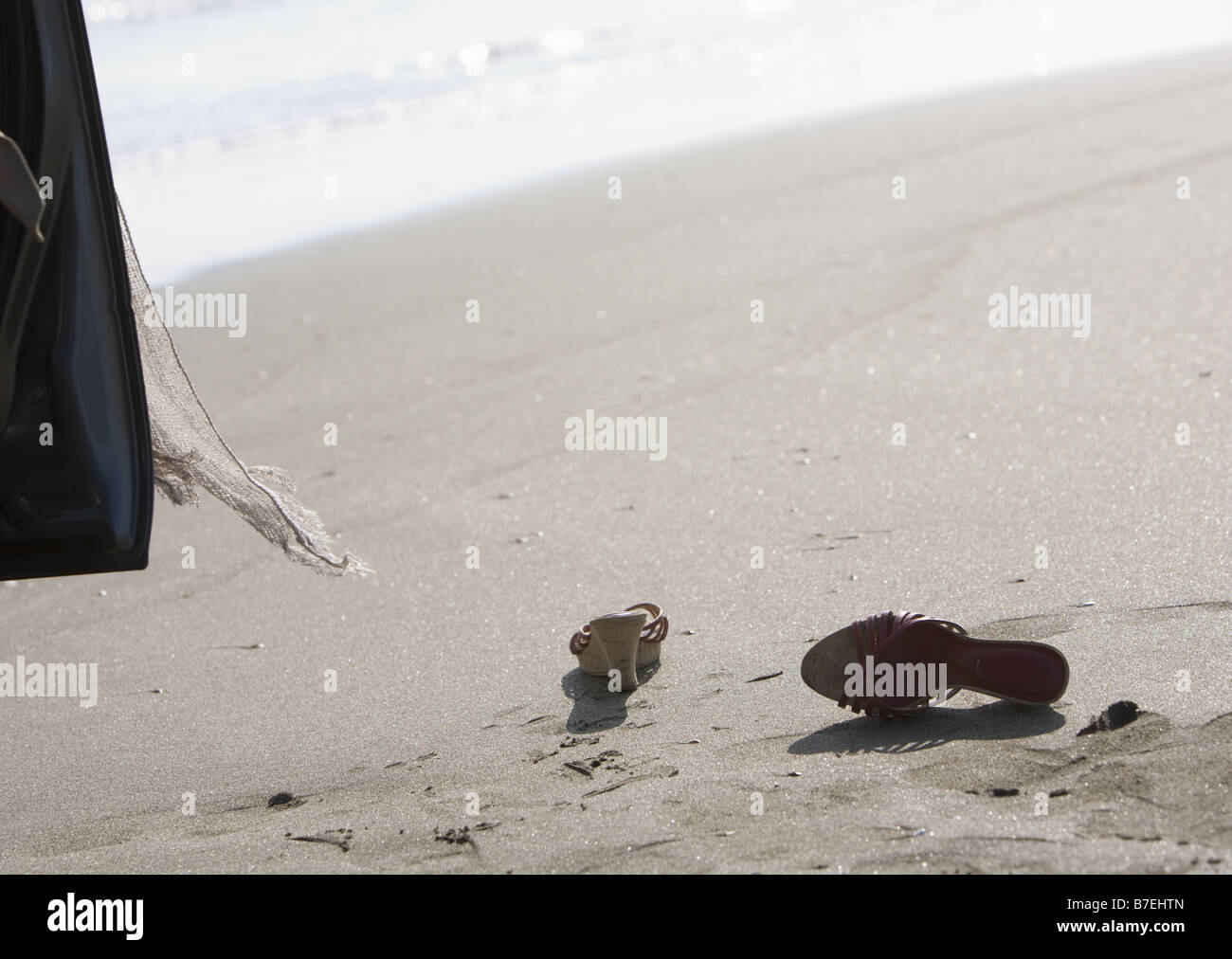 Sandals on a sandy beach Stock Photo
