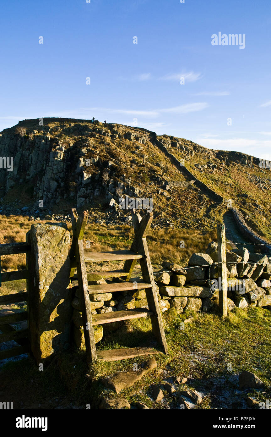 dh Steel Rigg HADRIANS WALL NORTHUMBRIA Walking stile Roman wall Northumberland National Park ramble country uk Stock Photo