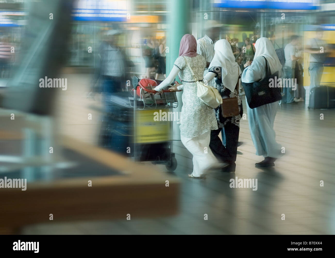 moslim women traveling at the airport motion blur Stock Photo - Alamy